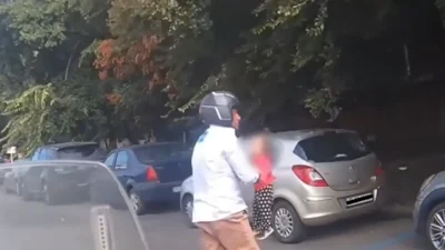Mama fetiței salvată de pe o șosea din București are acum dosar penal. Ce a spus după ce un motociclist i-a luat copila dintre mașini